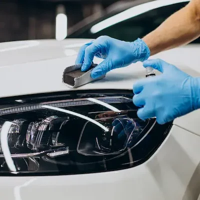 man-working-car-detailing-coating-car